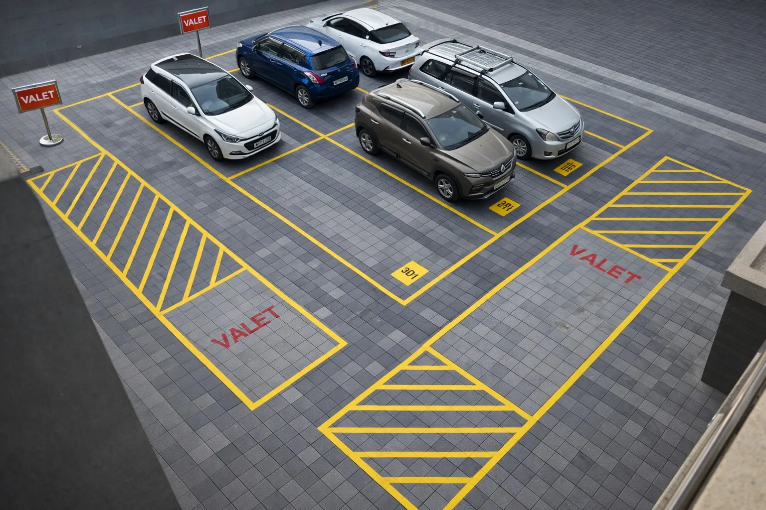 Overview of professional valet parking facility with organized car parking